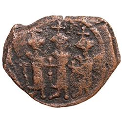 ARAB-BYZANTINE: Three standing figures, ca. 640s, AE fals (3.63g), "Cyprus", year "17"