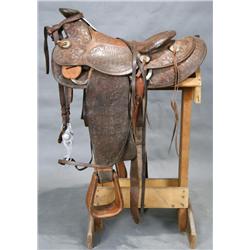 1948 World Champion Rodeo finely tooled Saddle with bridal.  Saddle won by World Champion Calf Roper