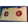 737. 45 RPM Record Album case with a large group of records including