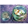 1359. (30) Old Glass Marbles in a Green Ball Wire Lid Jar.