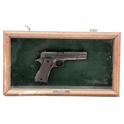 CAST MODEL OF A COLT 1911 IN FRAMED SHADOWBOX