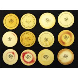 Twelve individual antique ivory poker chips