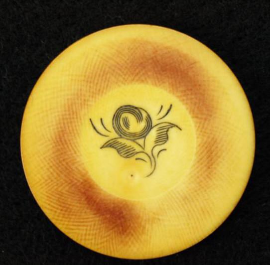 Twelve individual antique ivory poker chips