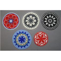 COLLECTION OF BEADED ROSETTES