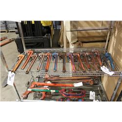 SHELF OF PIPE WRENCHES