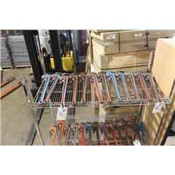SHELF OF PIPE WRENCHES