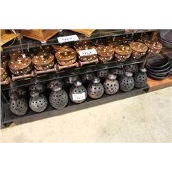 SHELF OF POTTERY CANDLE COVERS