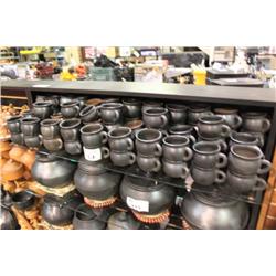 SHELF OF POTTERY CUPS