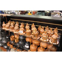 SHELF OF POTTERY BELLS