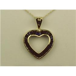 Ladies 10K YG Heart Design Pendant Custom made, channel set with over 1.00 carat in fine color blue 