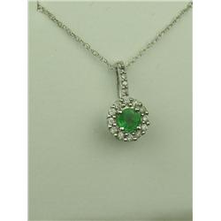 Charming 10K White Gold Ladies Necklace Set with a round emerald of over 0.50 carats and pave set wi