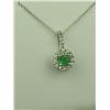 Image 1 : Charming 10K White Gold Ladies Necklace Set with a round emerald of over 0.50 carats and pave set wi