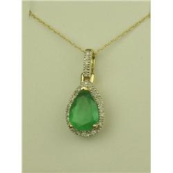 Wonderful 10K Yellow Gold Ladies Pendant Set with a center pear shape fern green Colombian emerald w