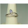 Image 1 : Hi-Quality Ladies 10K WG Ring Custom design, set with a trilliant cut Tanzanite and fine set with 18