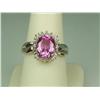 Image 1 : Brilliant 10K Yellow Gold Ladies Ring Set with a center pink topaz weighing approx. 3.00 carats and 
