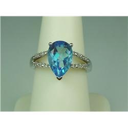 Stylish 10K White Gold Ladies Ring Set with a center pear shape blue topaz weighing approx. 3.50 car