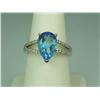 Image 1 : Stylish 10K White Gold Ladies Ring Set with a center pear shape blue topaz weighing approx. 3.50 car
