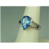 Image 2 : Stylish 10K White Gold Ladies Ring Set with a center pear shape blue topaz weighing approx. 3.50 car