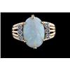 Image 1 : Beautiful Ladies Oval Shaped Opal Ring Three round cut diamonds on each side of opal, set in 14K yel