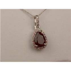 Pleasant 10K WG Ladies Handmade Necklace Set with a pear shape reddish/purple garnet weighing approx