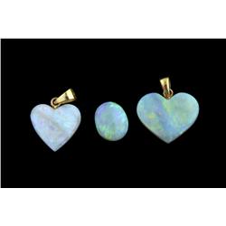Collection of 3 Opals One loose crystal opal 2.77cts, and two heart shaped opal pendants.One loose c