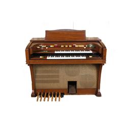 Walnut Cased Organ In Good Working Condition Has accompaniment, solo, and special effects switches, 
