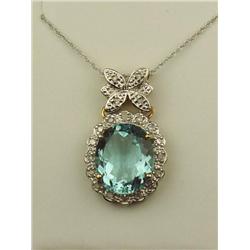 Dazzling 10K -2 Tone Gold Ladies Pendant Set with a large Sky blue topaz weighing approx. 6.00 carat