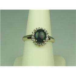 Pleasant 10K Yellow Gold Ladies Ring Set with a center Australian black Opal weighing approx 2.0 car