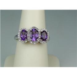 Dazzling 10K White Gold Ladies Ring Fine set with 3 matching oval Amethyst weighing approx. 2.00 car