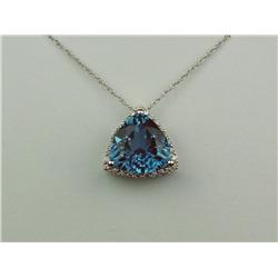 Quality 14K WG Ladies Custom Made Pendant Set with a trilliant cut London blue topaz weighing approx