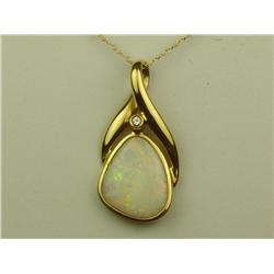 Nice 14K YG Ladies Custom Made Pendant Bezel set with a fine play of color Australian opal and bezel