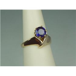 Pleasant 14K YG Ladies Freeform Design Ring Set with a fine round cobalt blue sapphire weighing 1.28