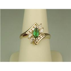 Exquisite 14K YG Ladies Designer Ring Set with a very fine green Colombian emerald weighing approx. 