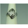 Image 1 : Brilliant 10K YG Ladies Swirl Design Ring Channel set with over 30 baguette and round diamonds weigh