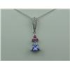 Image 1 : Ladies 14K WG Custom Design Pendant Set with a center trilliant cut Tanzanite weighing approx. 1.00 
