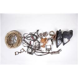Western Extravaganza Lot Includes several rawhide larriots, a pair of leather tapaderos, reproductio