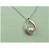 Image 1 : Charming 10K White Gold Ladies Pendant Set with a center round pearl averaging 7.00mm in diameter an