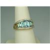 Image 1 : Dazzling 14K Yellow Gold Ladies Ring Fine set with 5 graduating emerald cut blue topaz weighing appr