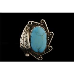 Navajo Ladies Turquoise Ring Set in sterling silver with feather type design.Set in sterling silver 