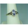 Image 1 : Dazzling 14K Yellow Gold Ladies Ring Set with a center MQ cut Tanzanite and 10 round diamonds with a