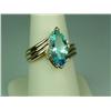 Image 2 : Ladies 14K YG Bypass Ribbed Design Ring Set with a fine center MQ cut sky blue topaz weighing approx