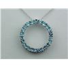 Image 1 : Ladies 10K WG "Circle of Life" Pendant Set with 22 round blue topaz weighing approx. 2.00 carats. Re