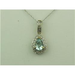Elegant 10K Yellow Gold Ladies Pendant Set with a center sky blue topaz weighing over 1.00 carat and