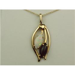 Stylish 14K YG Ladies Custom Made Pendant Set with fine matching MQ shape Opal and black onyx. Retai