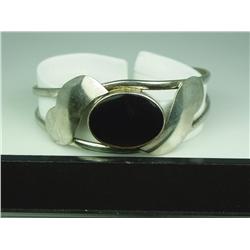 Elegant Ladies Sterling Silver Bangle Bracelet With bezel set onyx.With bezel set onyx.