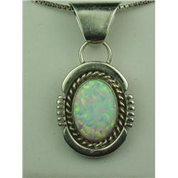 Ladies Handmade Sterling Silver Pendant Set with a fine play of color bezel set opal.Set with a fine
