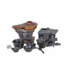 Lot of Child's Cast Iron Miniatures Consisting of a stove and several pots and pans.Consisting of a 