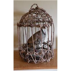 Chukar in grape vine cage