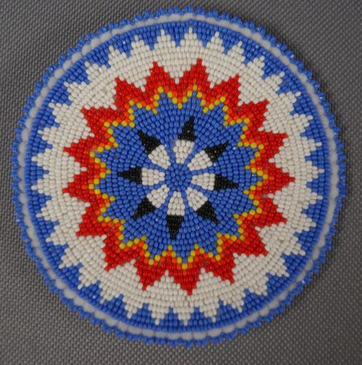 COLLECTION OF PLAINS BEADED ROSETTES