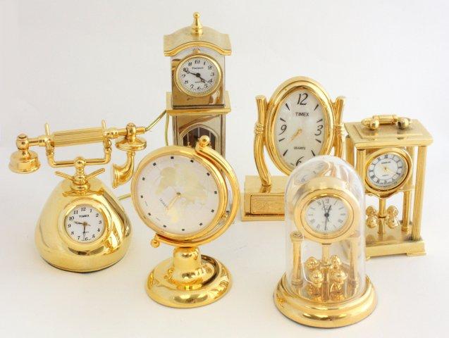 6 miniature brass clocks